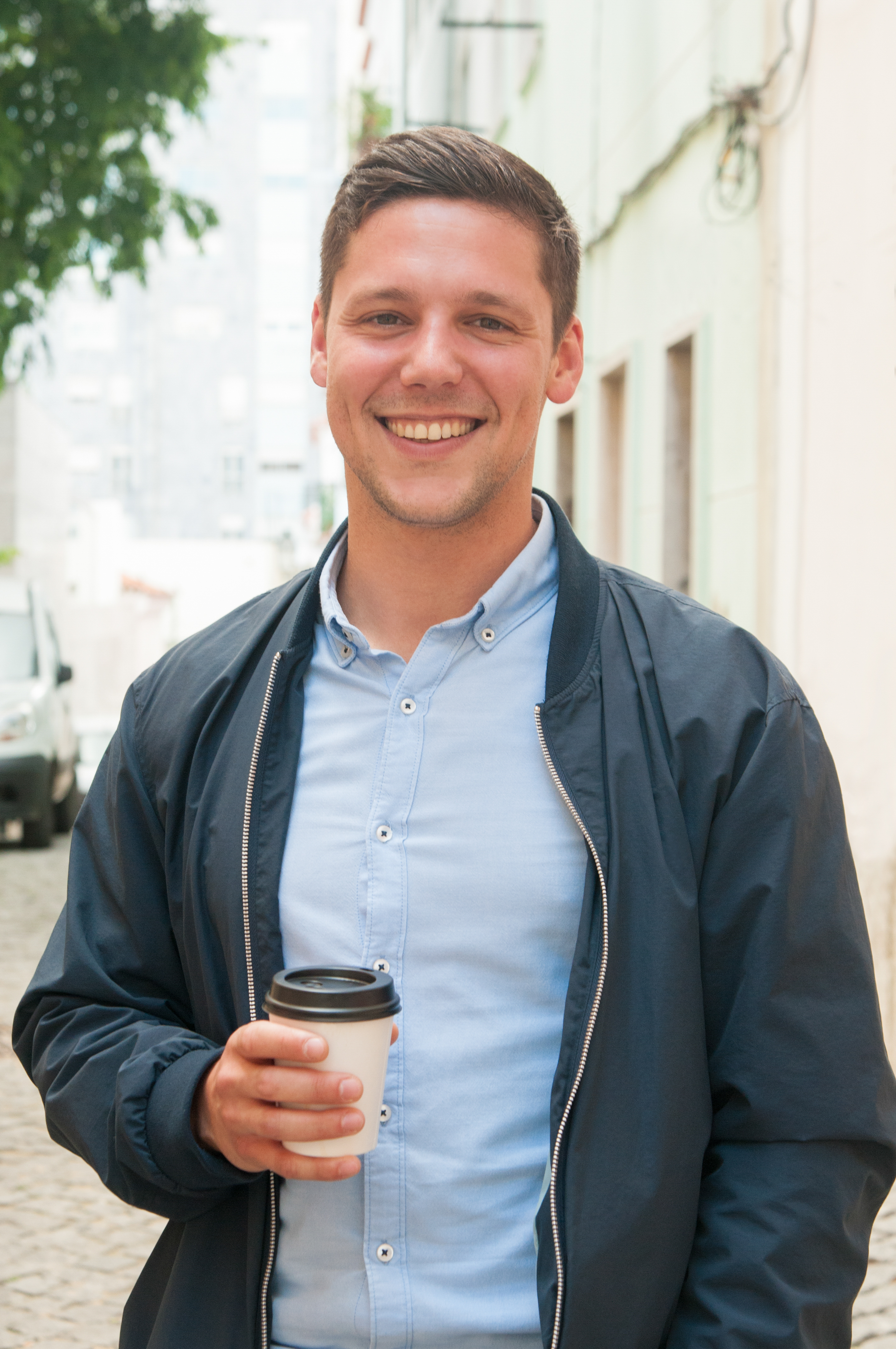 cheerful-guy-enjoying-outdoor-coffee-break.jpg